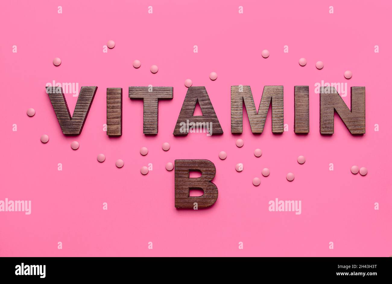 Text VITAMIN B with pills on color background Stock Photo