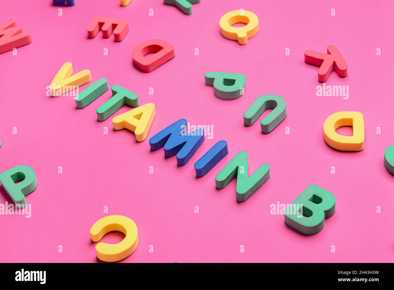 Text VITAMIN B with letters on color background Stock Photo