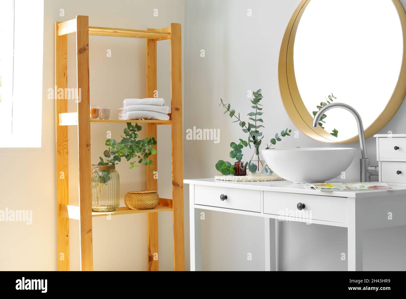 eucalyptus in vase in bathroom