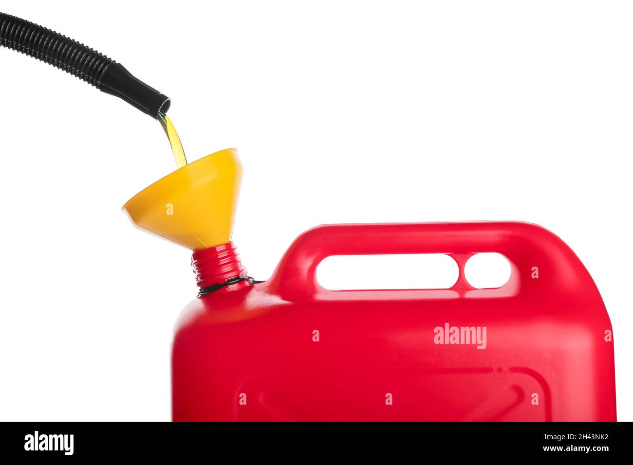 Pouring of motor oil in canister against white background, closeup