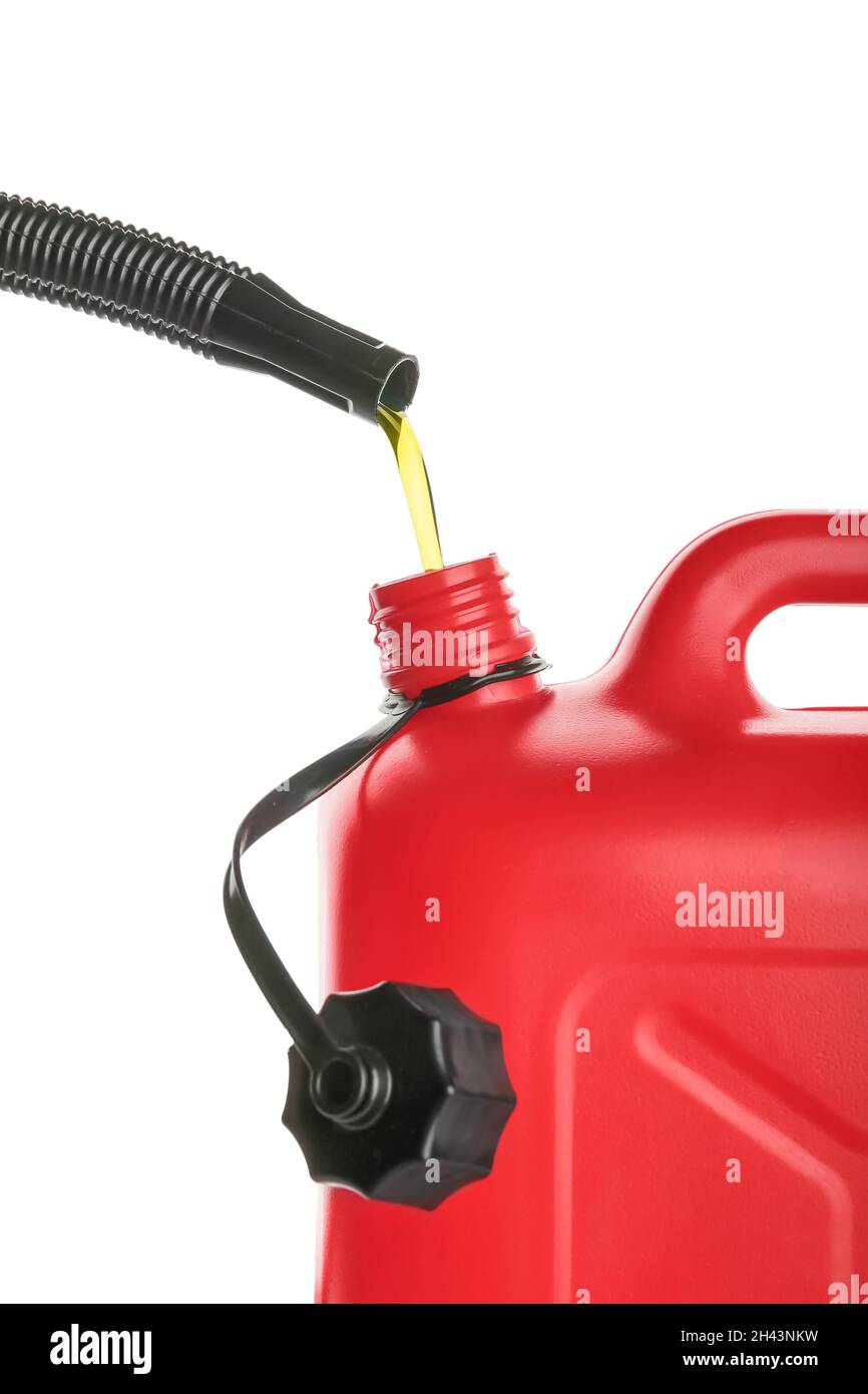 Pouring of motor oil in canister against white background, closeup