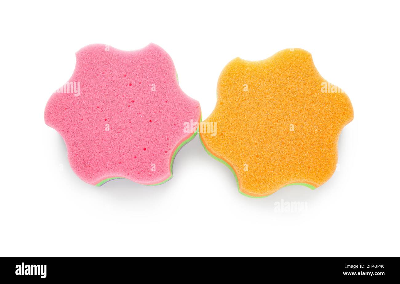 Pink and orange star shaped bath sponges on white background Stock