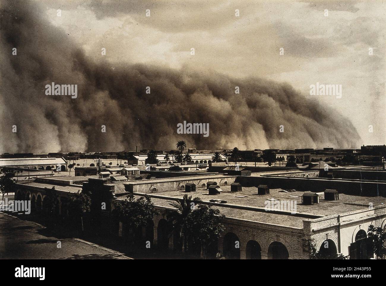 Dust storm over an African (?) town. Photograph, 1905/1915. Stock Photo