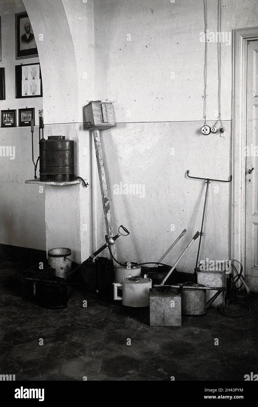 The anti-malaria school, Nettuno, Italy: large wooden-handled metal tools used in malaria control work. Photograph, 1910/1940 (?). Stock Photo