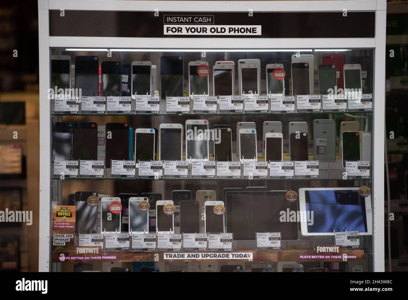 Second hand mobile phones for sale in a pawn shop in Wales. Stock Photo