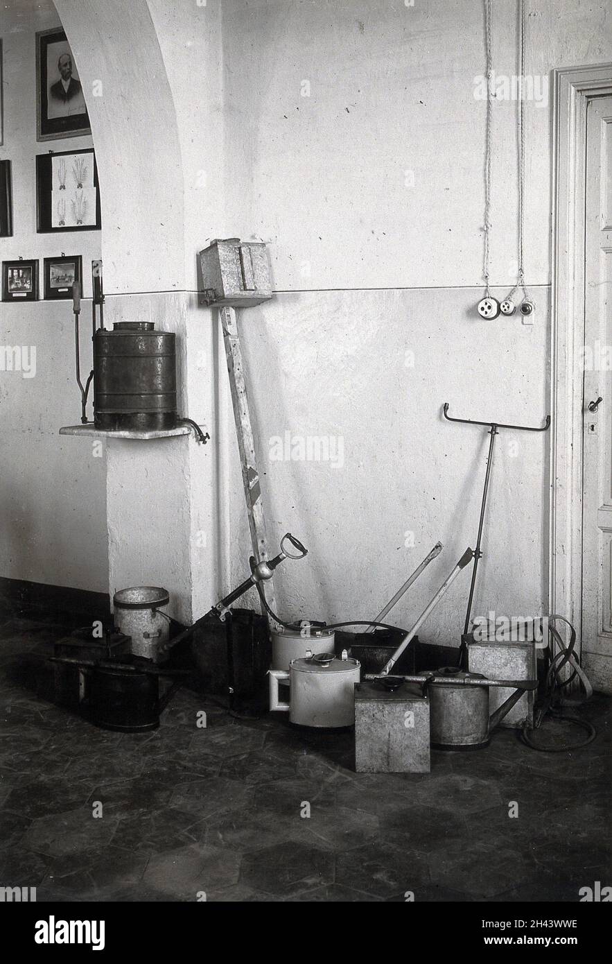 The anti-malaria school, Nettuno, Italy: oil cans used in malaria control work. Photograph, 1910/1940 (?). Stock Photo