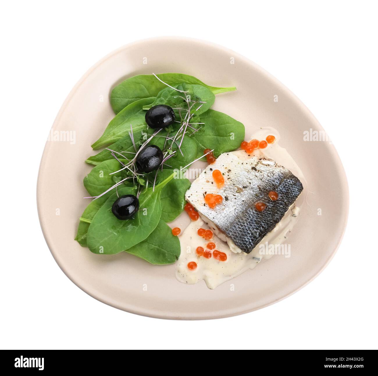 Plate of tasty sea bass fish with red caviar on white background Stock
