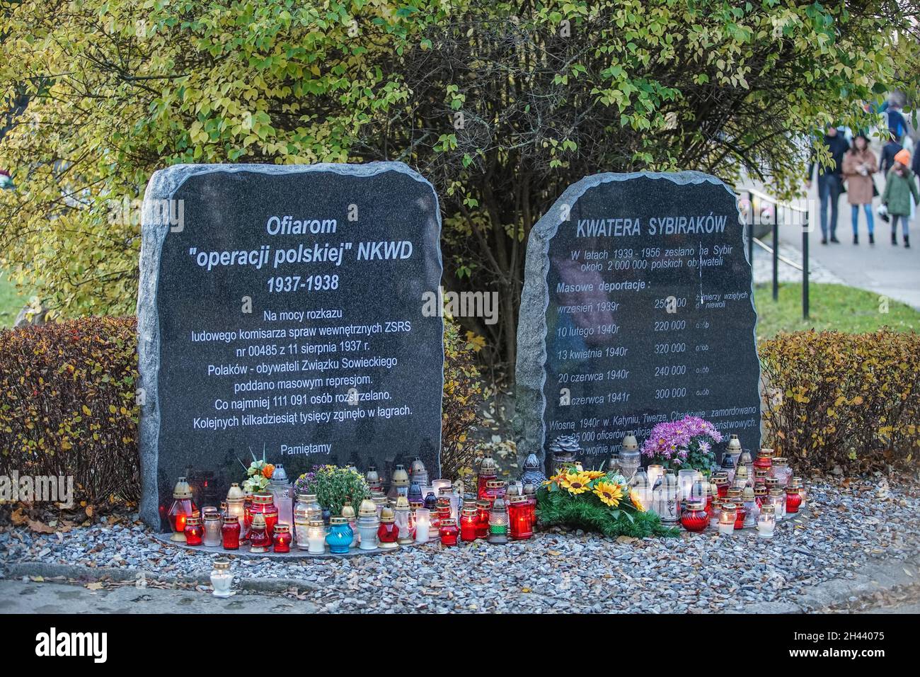 Gdansk, Poland 31st, Oct. 2021 People visiting graves of their relatives at the Lostowicki Cemetery are seen. Christian people celebrate All Saints Day (Wszystkich Swietych), pay respect to the dead family members, lay flowers and lit candles on their graves. All Saints' Day on 1 November and All Souls' Day on 2 November are when millions of Poles visit the graves of loved ones, often travelling hundreds of kilometres to their home towns. In 2021 as the 1st Nov is on Monday many of people visit graves on the weekend preceding that day. (Photo by Vadim Pacajev/Sipa USA) Stock Photo