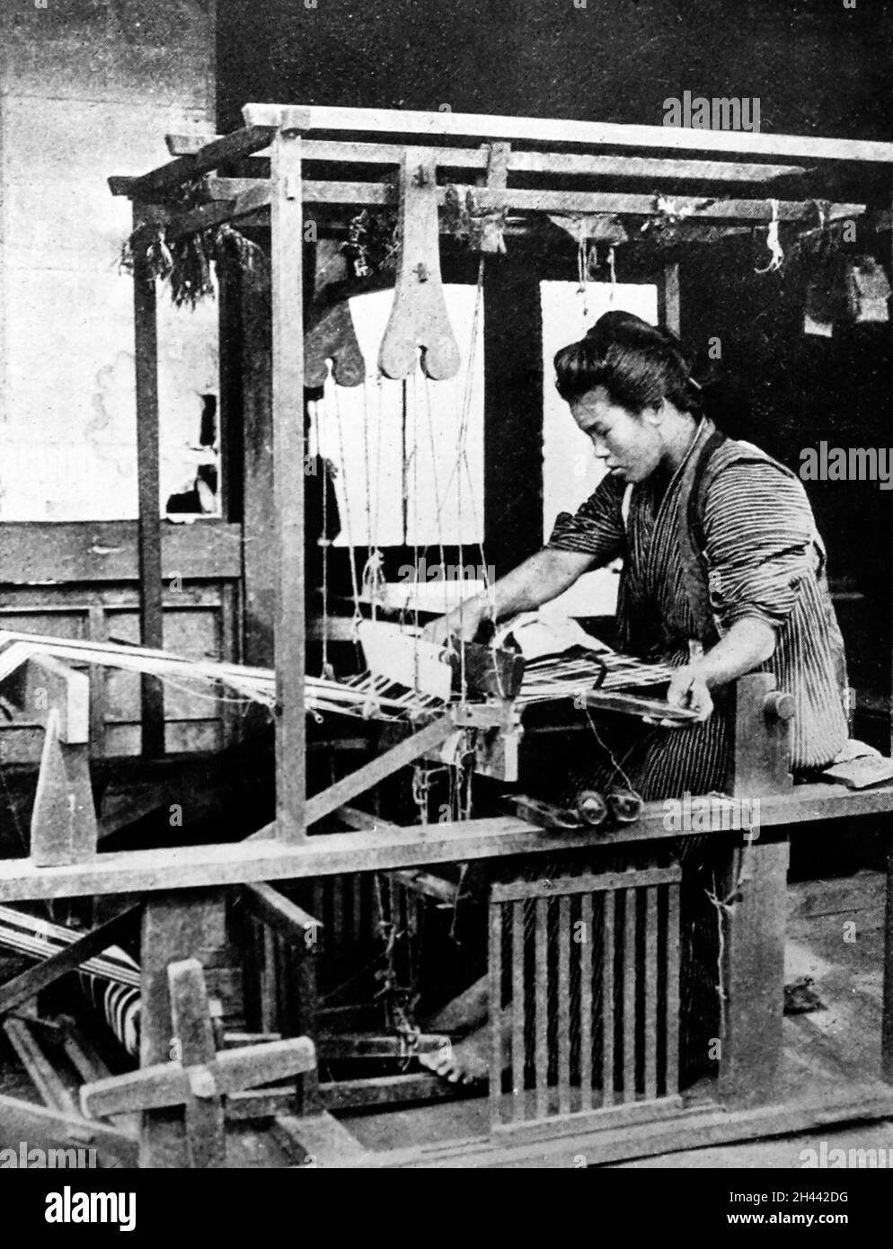 Weaving cotton with a hand loom, Japan, early 1900s Stock Photo