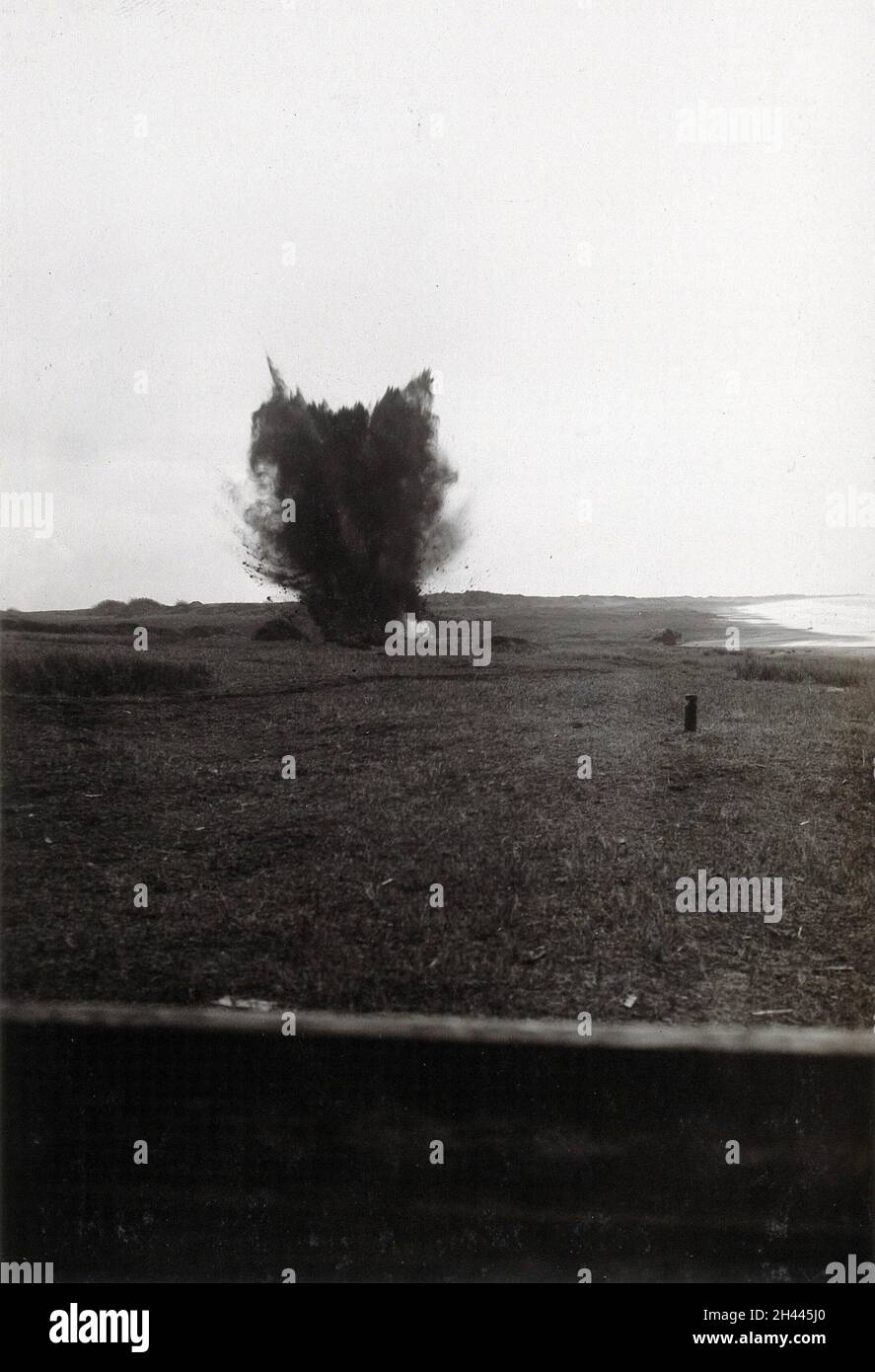 Nettuno, Italy: an explosion of black smoke in a field. Photograph, 1910/1940 (?). Stock Photo