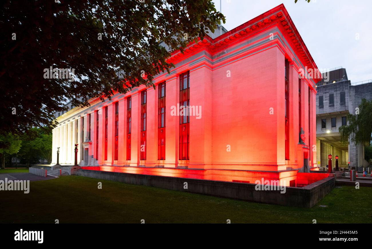 CARDIFF, WALES - MAY 28: The Welsh Government Building at Cathays Park lit up red in support of Wales in the Euros on May 28, 2021 in Cardiff, Wales. Stock Photo