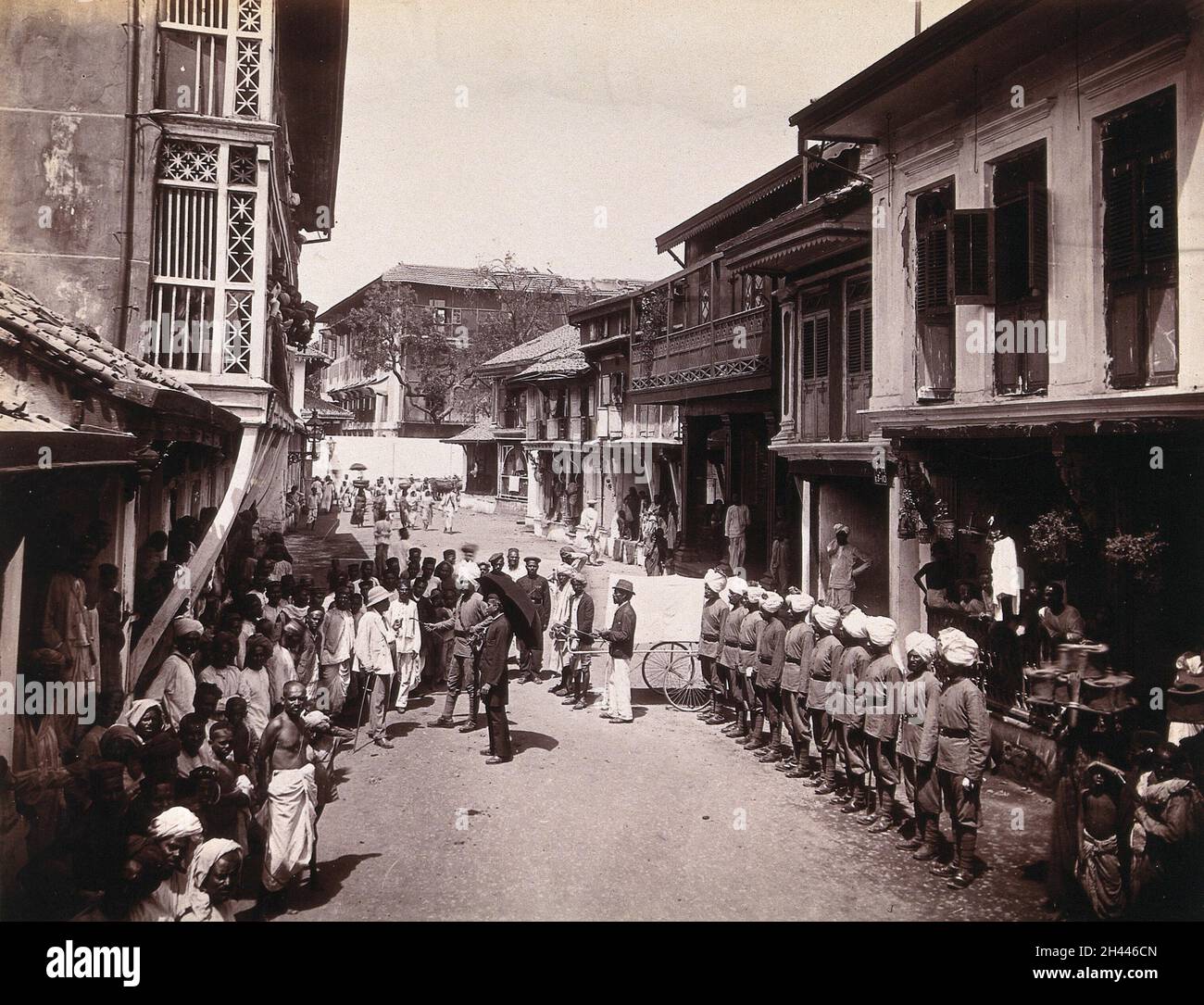 A group of officials making a visit to a house in Bombay, suspected of