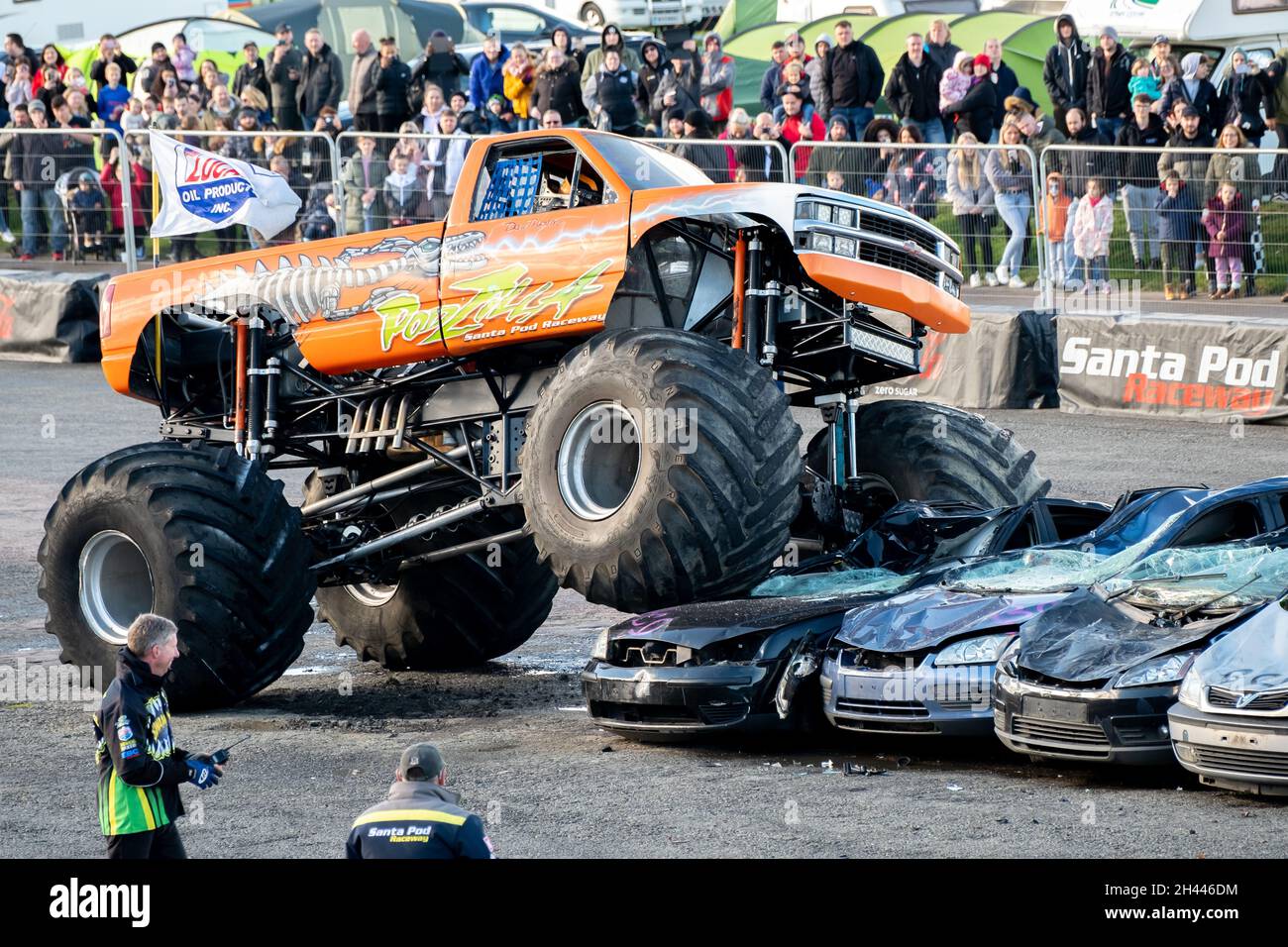 The Podzilla monster truck jumping cars during a live performance at ...