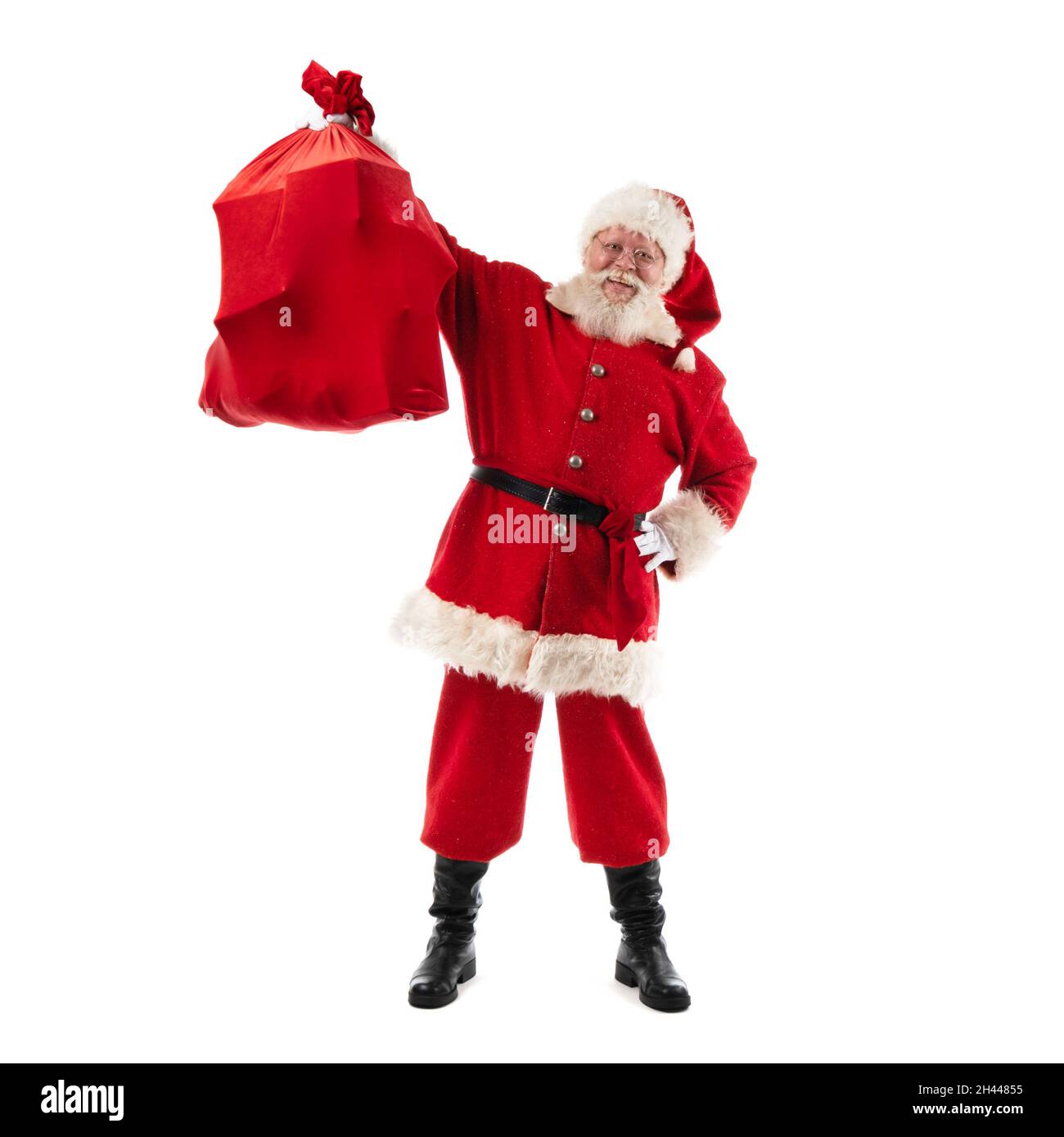 Santa Claus shows Christmas gift bag isolated on white background Stock ...