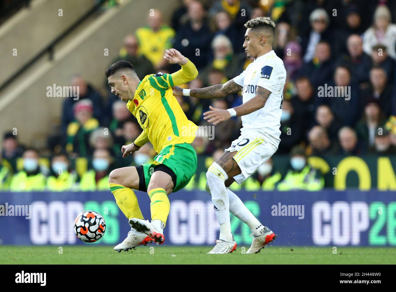 Raphinha #10 of Leeds United tackles Milot Rashica #17 of Norwich City Stock Photo