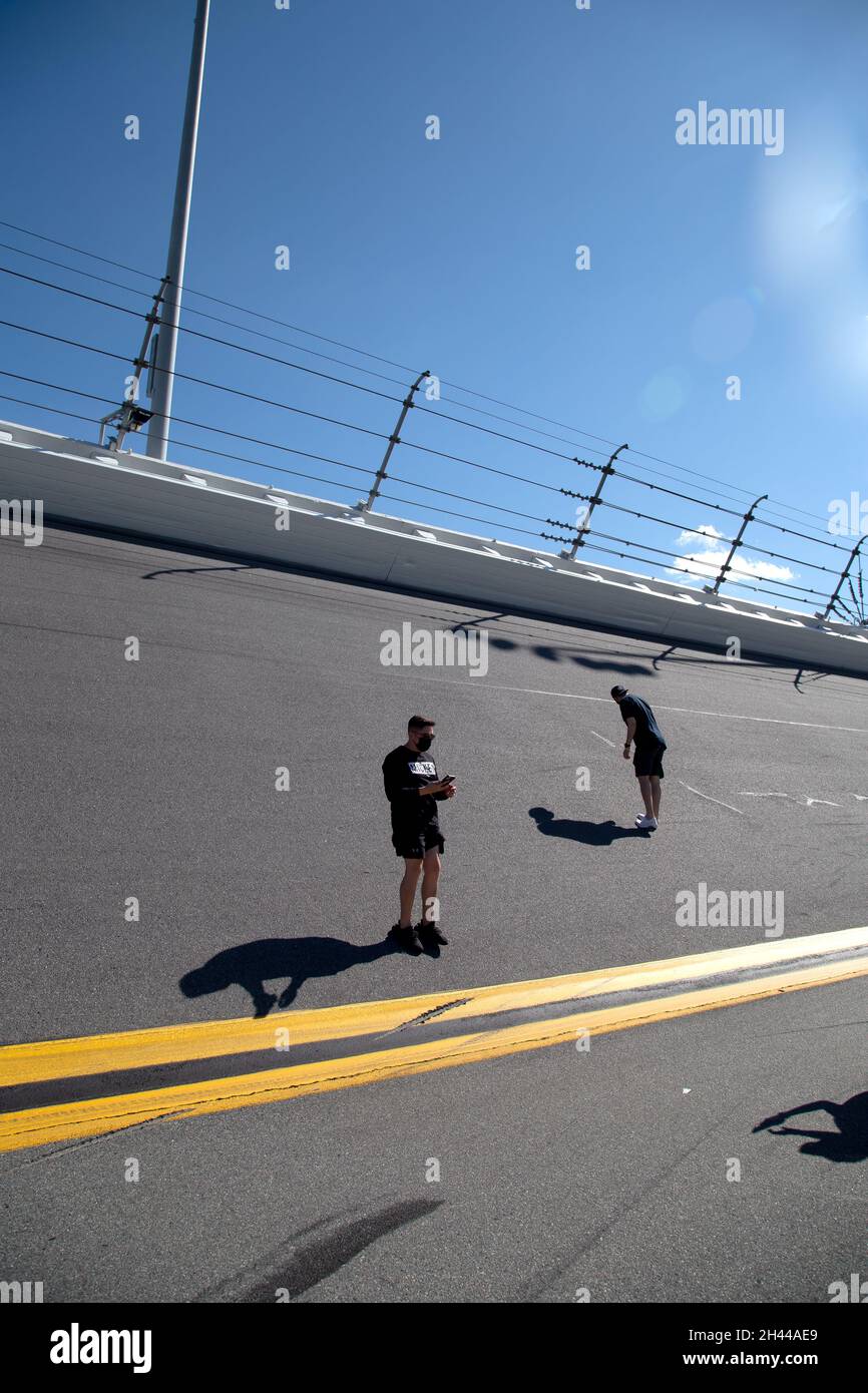The banked turns at the Daytona International Speedway are steeper than they look -- rising 31 degrees. These folks are discovering that. Stock Photo