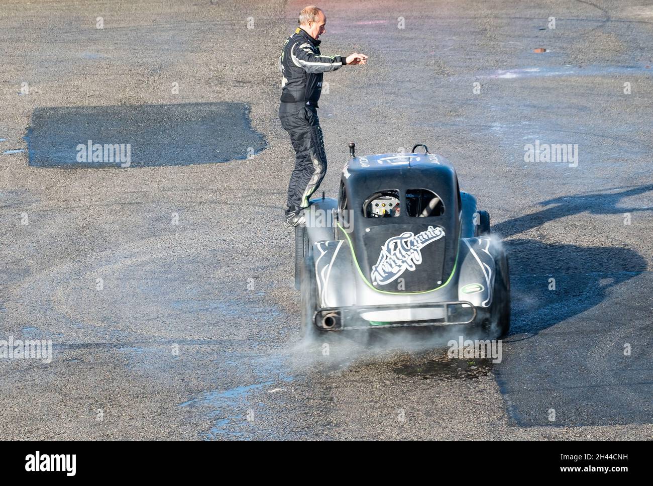 The World famous stunt driver Terry Grant putting on a dangerous stunt show at the Flame & Thunder event at Santa Pod race way, October 2021 Stock Photo