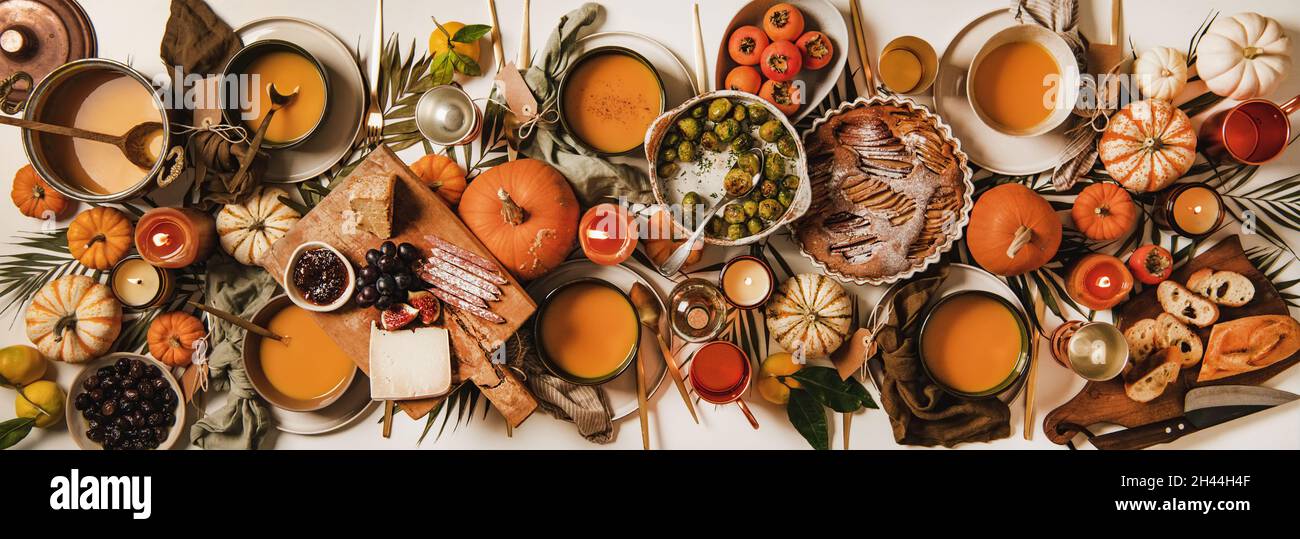 Autumn Thanksgiving Day festive table set for gathering Stock Photo