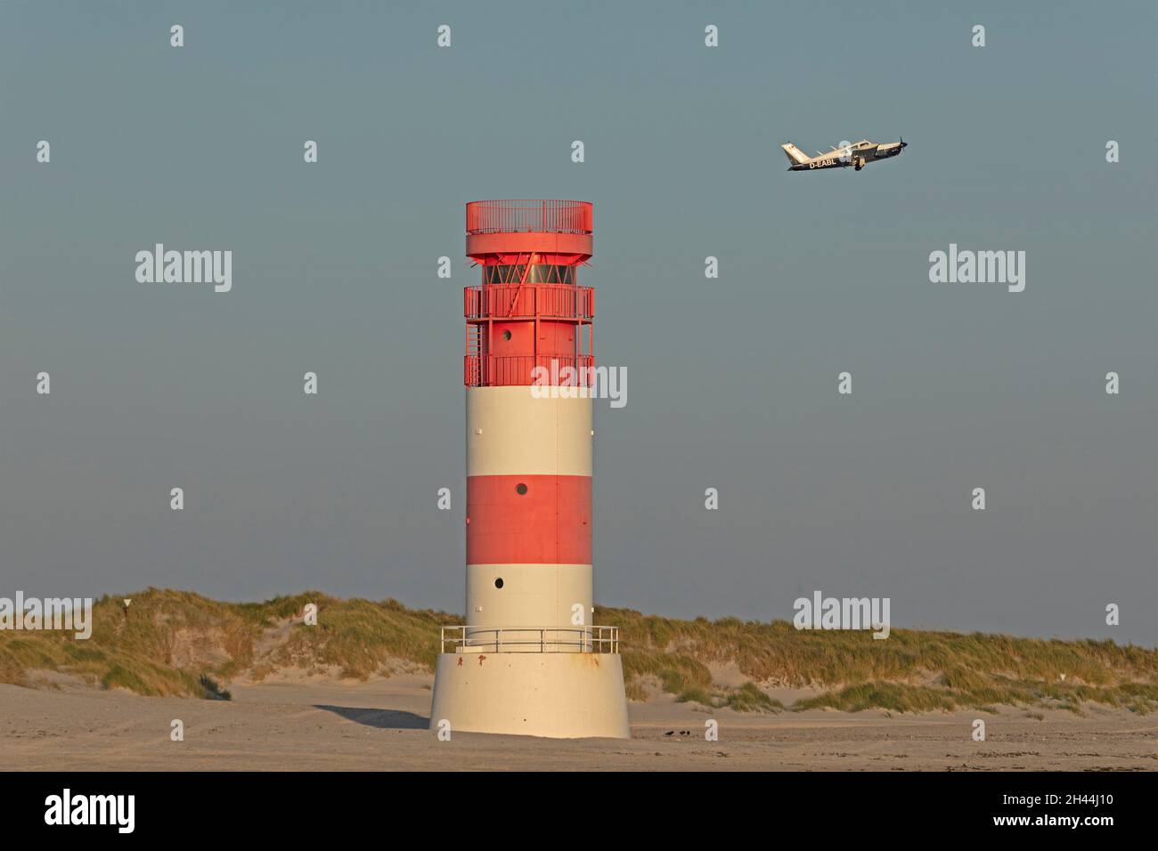 plane taking off, lighthouse on Düne, Heligoland Island, Schleswig-Holstein, Germany Stock Photo