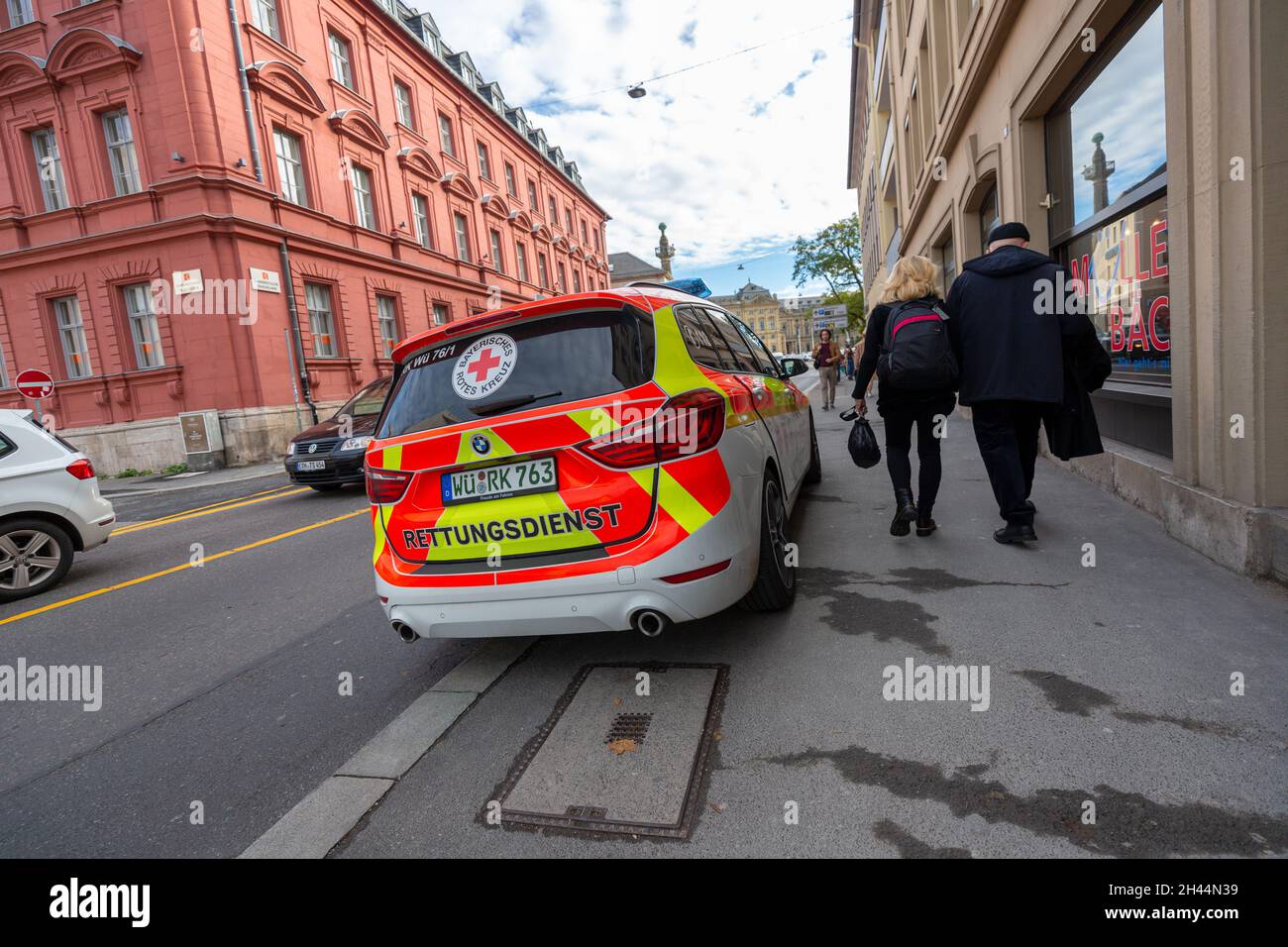 WUERZBURG, GERMANY - OCTOBER 31, 2021: A german Ambulance car from bavarian red cross stands near a street. Stock Photo