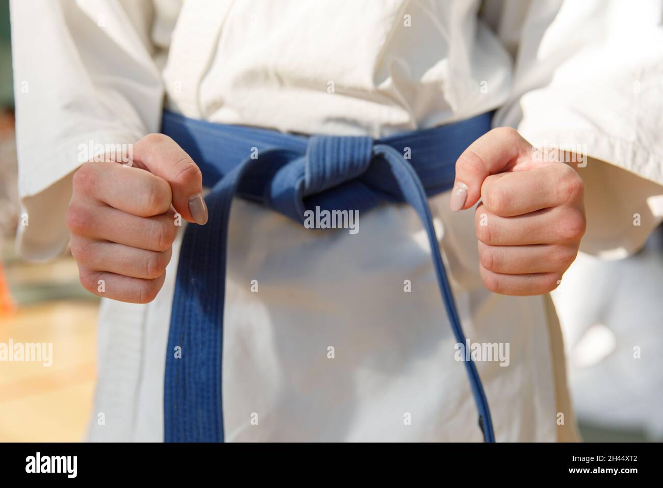 Karate students train in the martial arts hall. Martial arts school