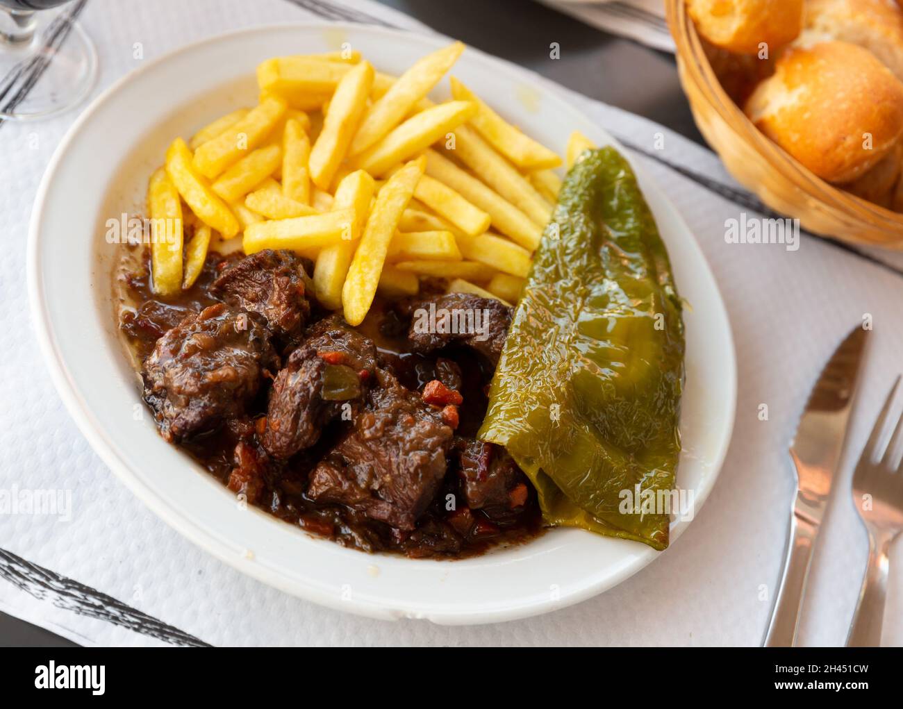 Beef stew in red wine with fries Stock Photo Alamy