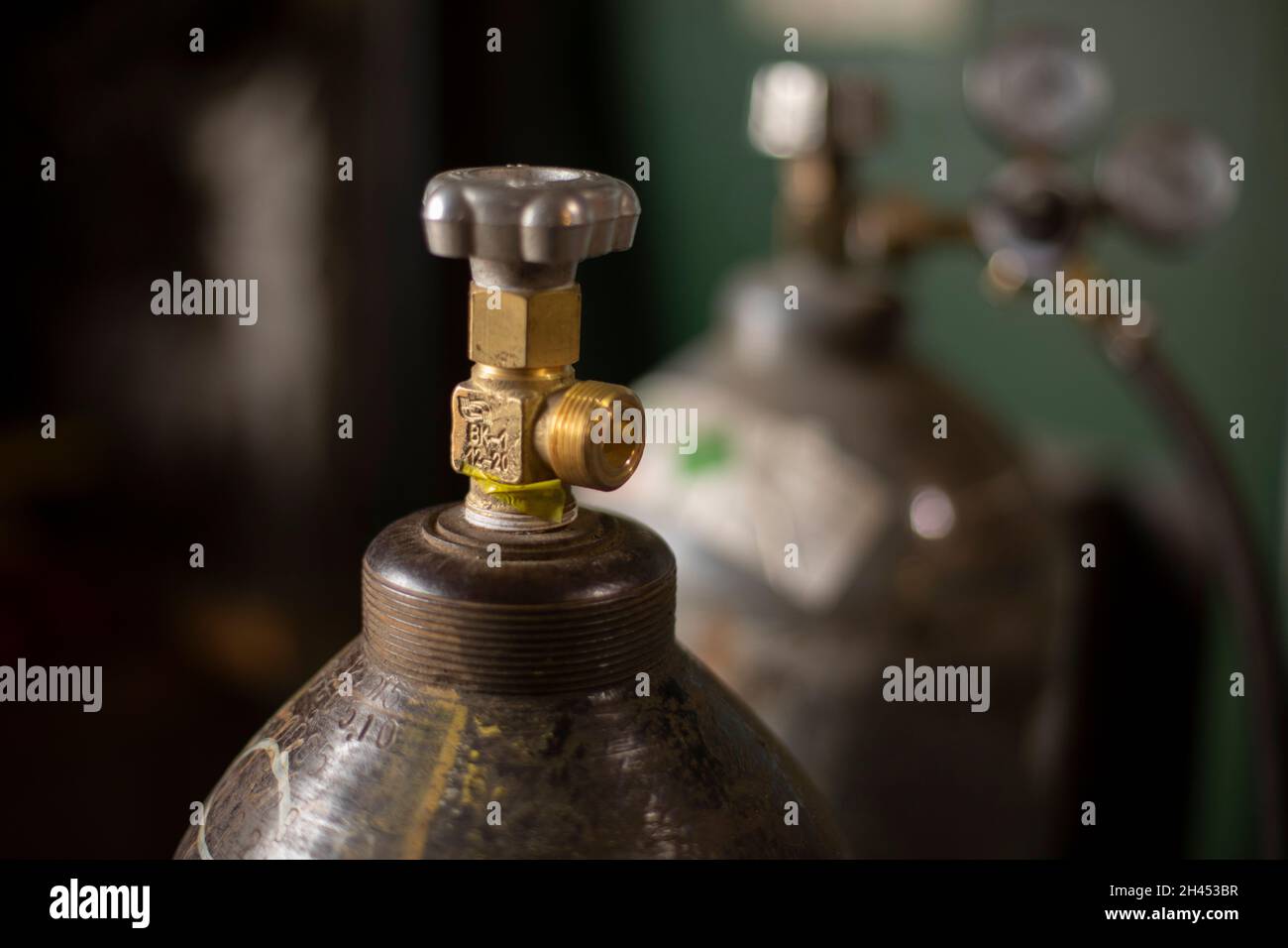 High pressure cylinder. Tank with gas. Valve for pressure adjustment