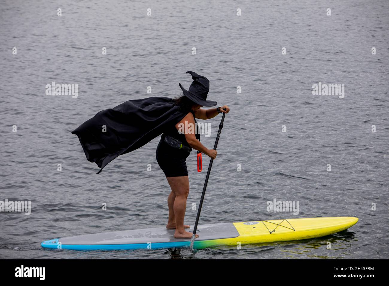 West Hills, California, USA. 31st Oct, 2021. Anna Solano paddle boards  dressed as a witch during the Second Annual South Bay Witches Paddle on  Halloween at King Harbor Marina in Redondo Beach,