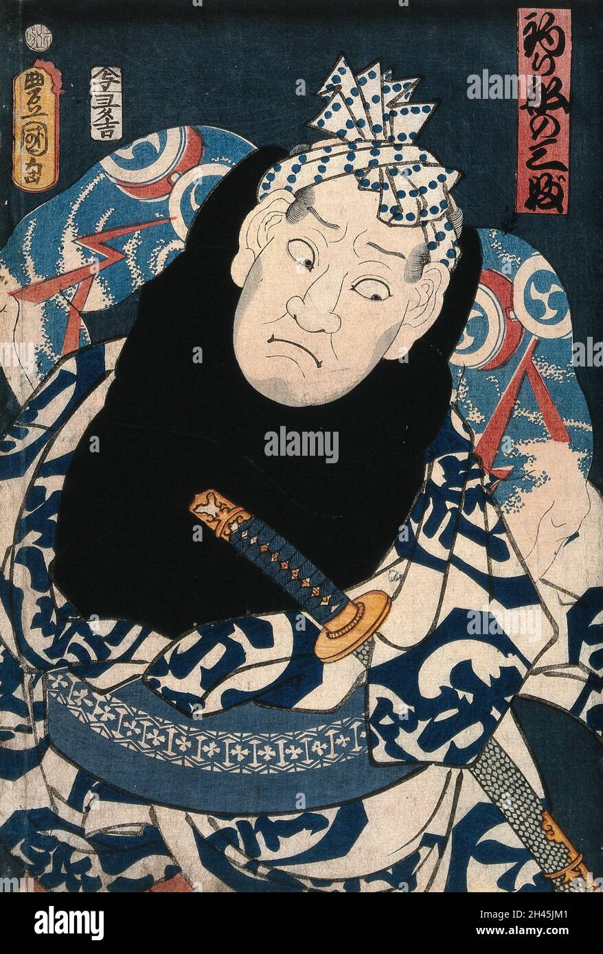 An actor as ruffian Tsuribune no Sabu, full face, revealing his tattoos. Colour woodcut by Kunisada I, 1859. Stock Photo