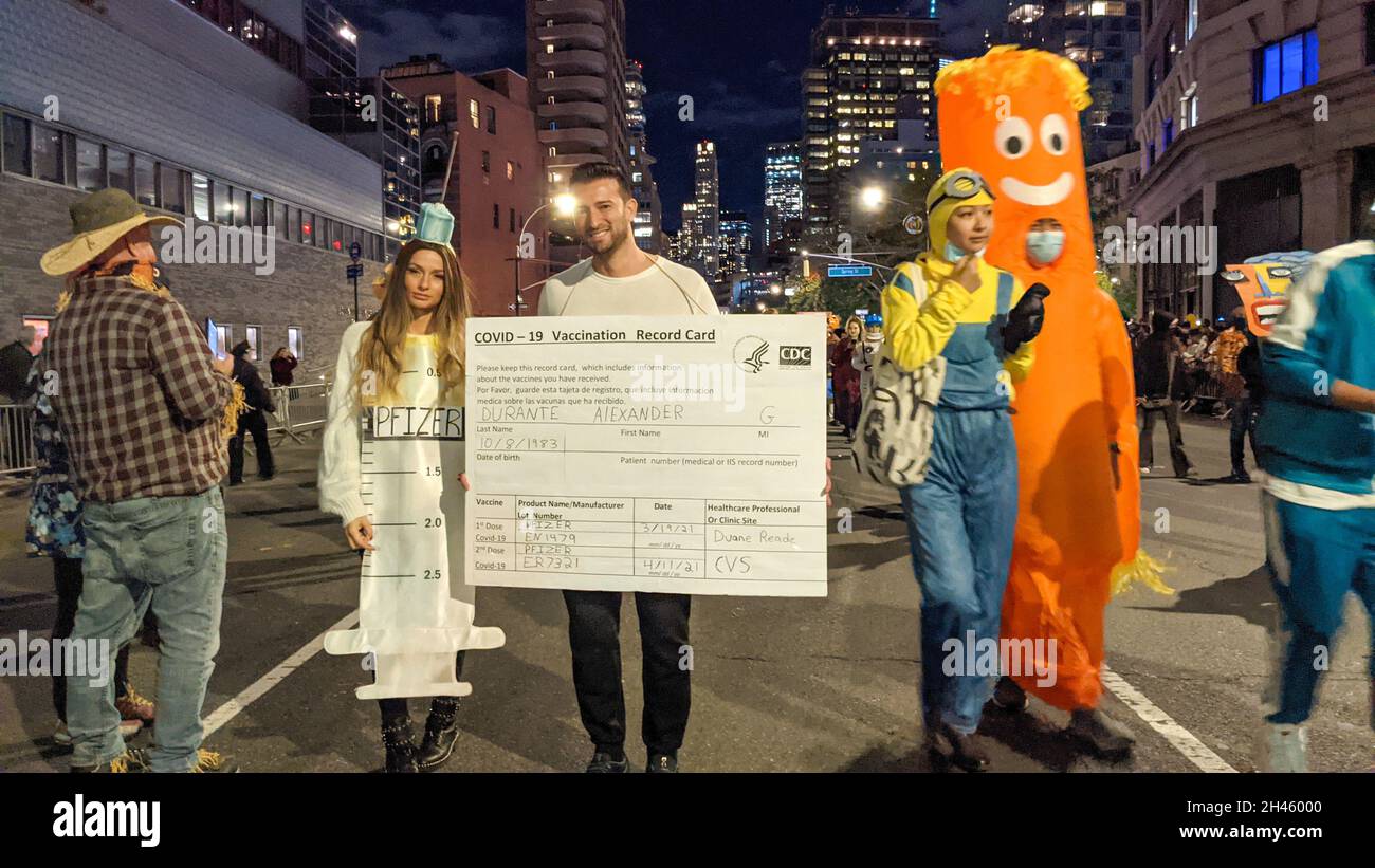 New York, United States. 31st Oct, 2021. A participant is seen dressed up as CDC Vaccine Card during the annual 48th Greenwich Village Halloween Parade along Sixth Avenue in New York City on October 31, 2021. (Photo by Ryan Rahman/Pacific Press) Credit: Pacific Press Media Production Corp./Alamy Live News Stock Photo