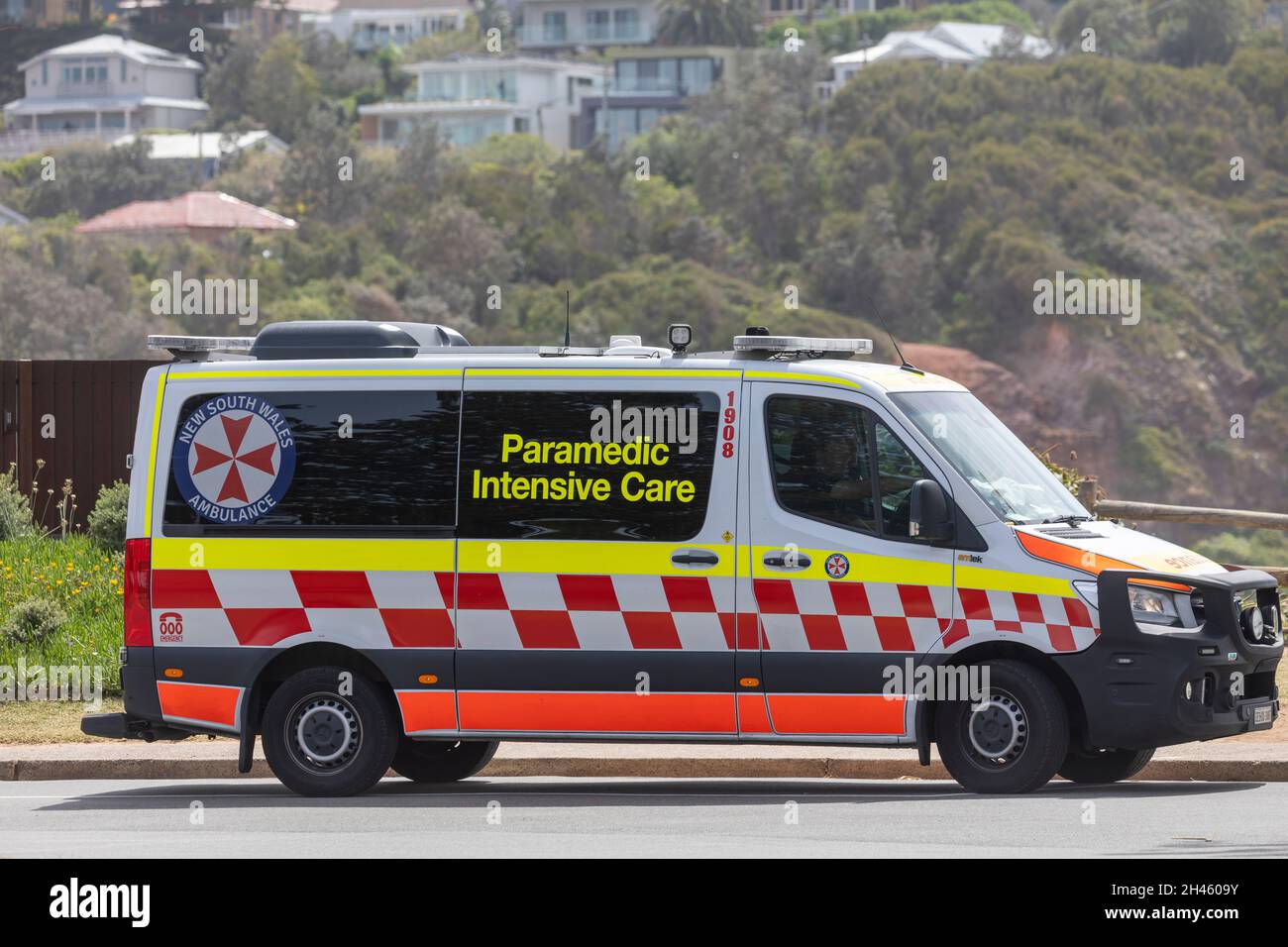 Australian ambulance paramedic at the beach,NSW Health ambulance vehicle parked at Mona Vale Beach,Sydney,Australia Stock Photo