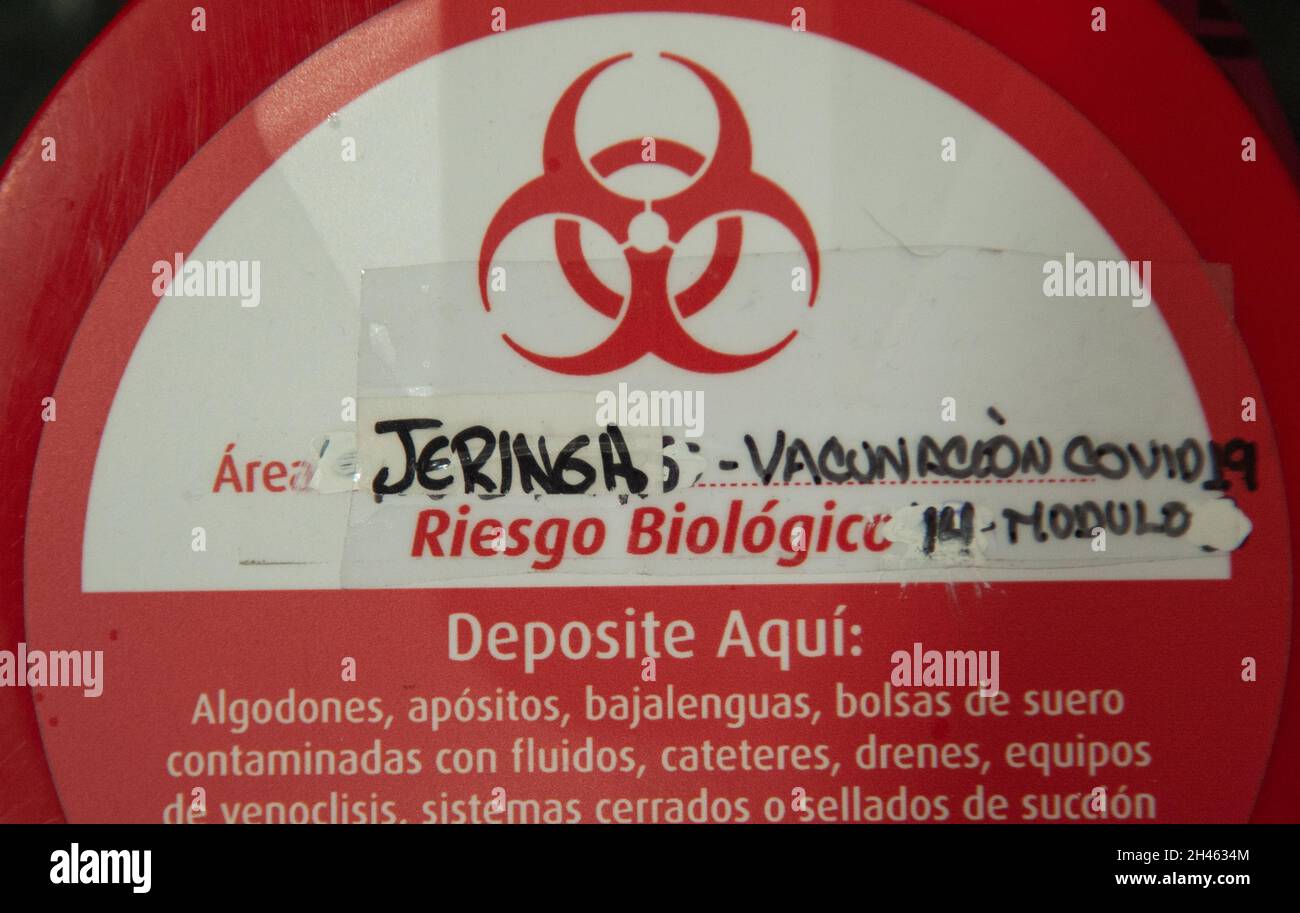 A hazardous can that reads 'COVID-19 Vaccination syringes' as the Colombian government begins to vaccinate children between ages 3 to 11 against the Coronavirus disease (COVID-19) with the China's SINOVAC vaccine, in Bogota, Colombia on October 31, 2021. Stock Photo