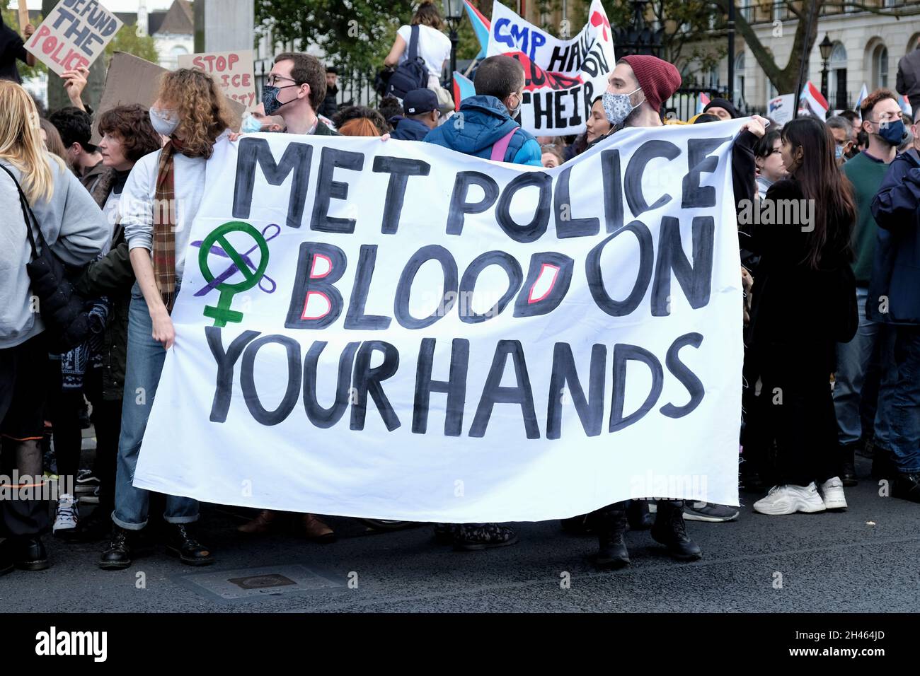London, UK. Protesters hold up a banner 'Met Police. Blood on your hands'  during the annual memorial march for those who died in police custody. Stock Photo