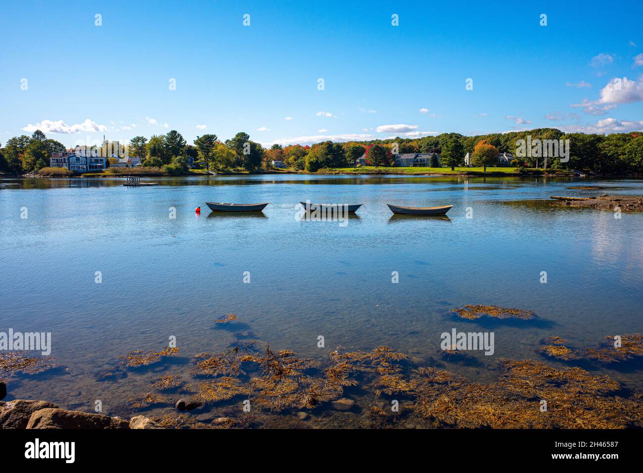 Three boats in the cove Dock Harbor in Kennebunkport Maine Stock Photo