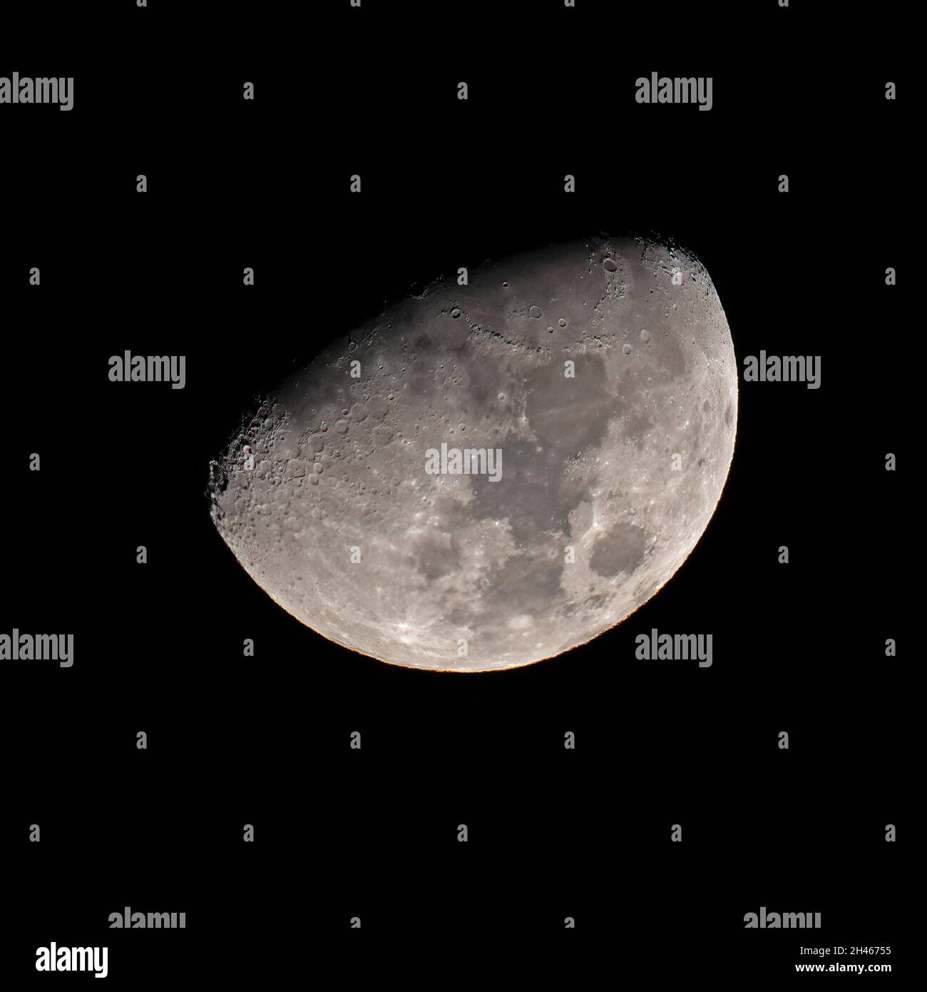 A Waxing Gibbous Moon against Black Sky Stock Photo