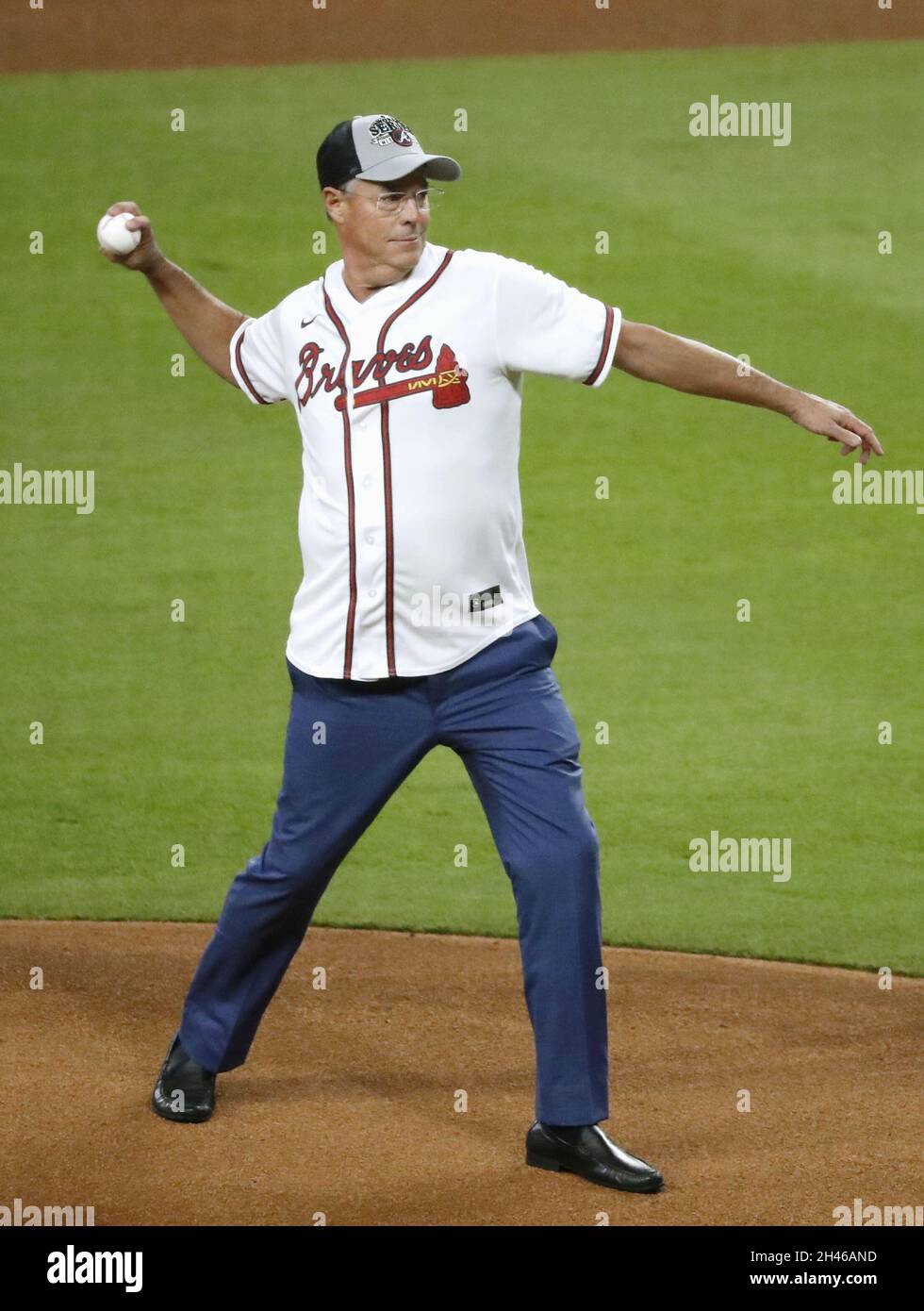 Hall of Famer and former Atlanta Braves pitcher Greg Maddux throws out