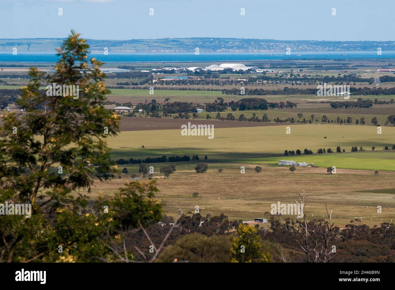 View from the You Yangs Regional Park across the basalt plains to Avalon Airport and Corio Bay, Victoria, Australia Stock Photo