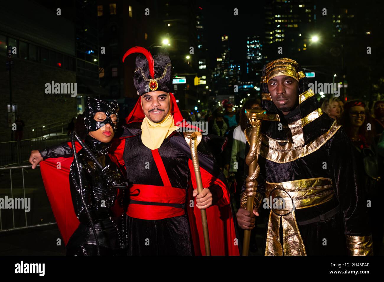 New York City, USA. 31st Oct, 2021. The annual Greenwich Village Halloween parade returned in 2021after a year's suspension because of COVID restrictions. Two men costumed as ancient Egyptian royalty with a woman in a black latex catsuit. Credit: Ed Lefkowicz/Alamy Live News Stock Photo