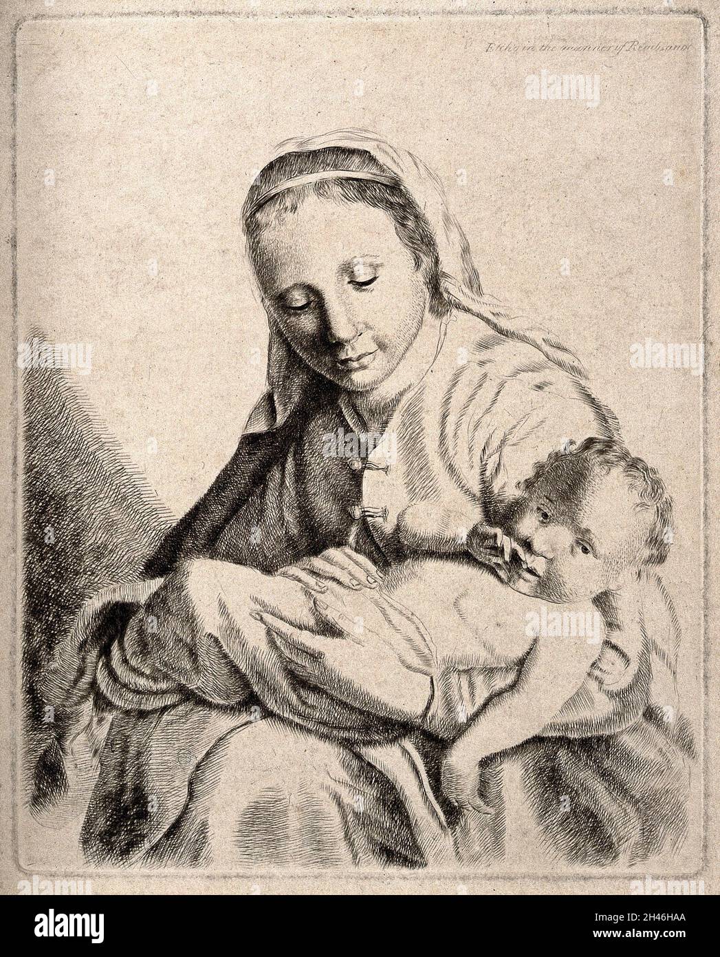 Woman lovingly holding baby hi-res stock photography and images - Alamy