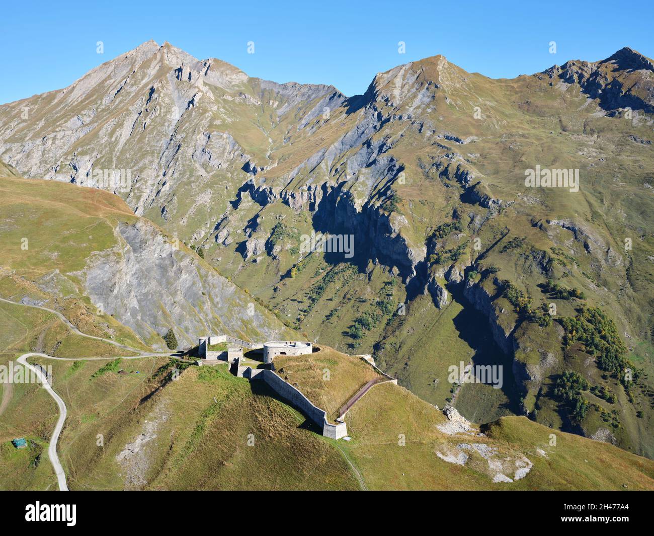 AERIAL VIEW. Military fortification from the late 1800s at an altitude of 2000m in the Tarentaise Valley. Fort de la Platte, Bourg-St-Maurice, France. Stock Photo