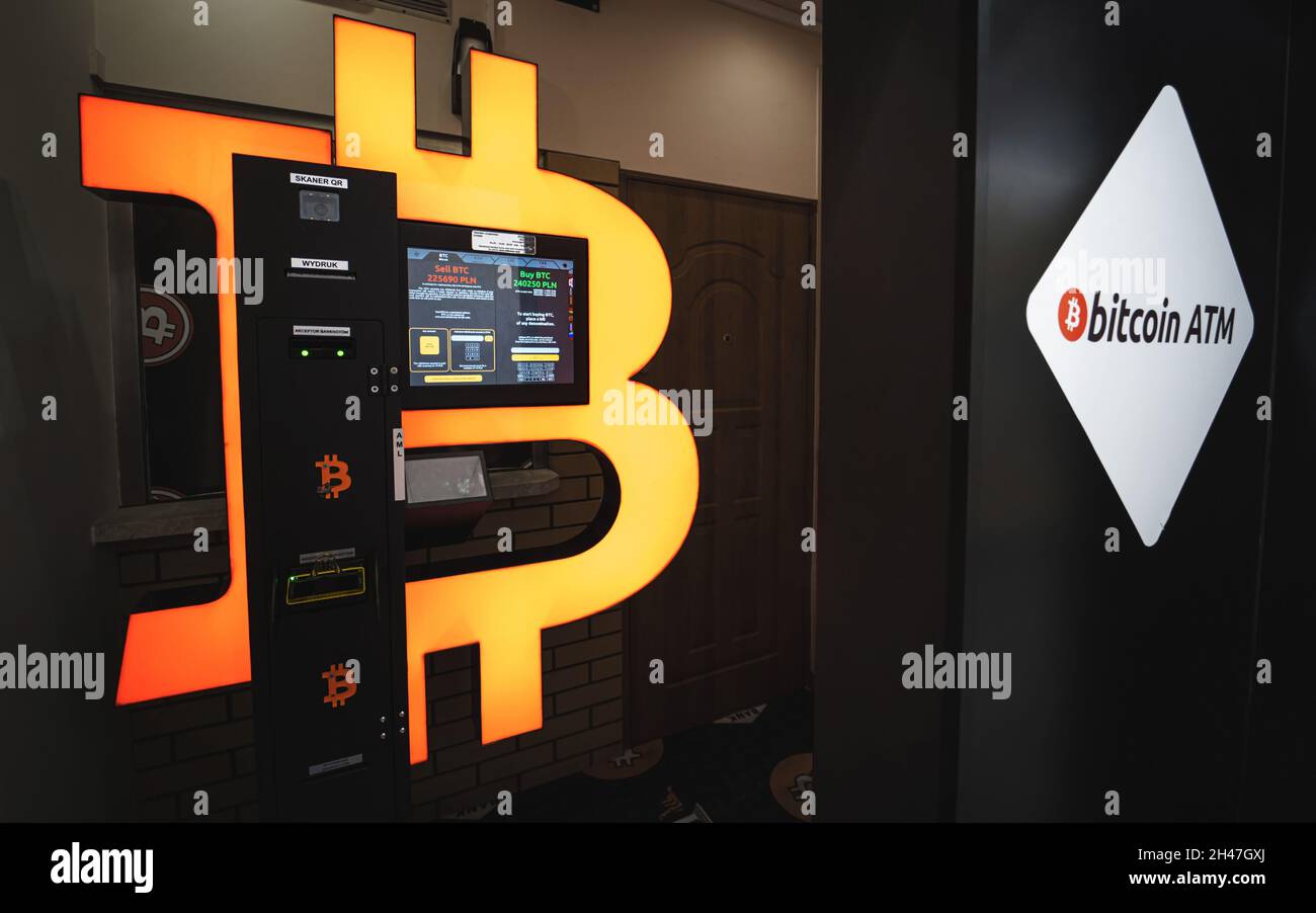 Bitcoin ATM in a mall allows to buy and sell Bitcoin crypto. Orange BTC cryptocurrency exchange machine. Warsaw, Poland - October 23, 2021 Stock Photo