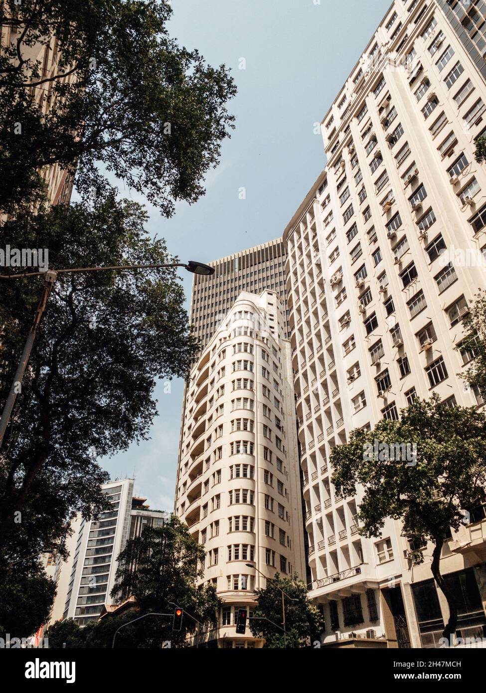 Low angle shot of high rise building under a blue sky Stock Photo - Alamy