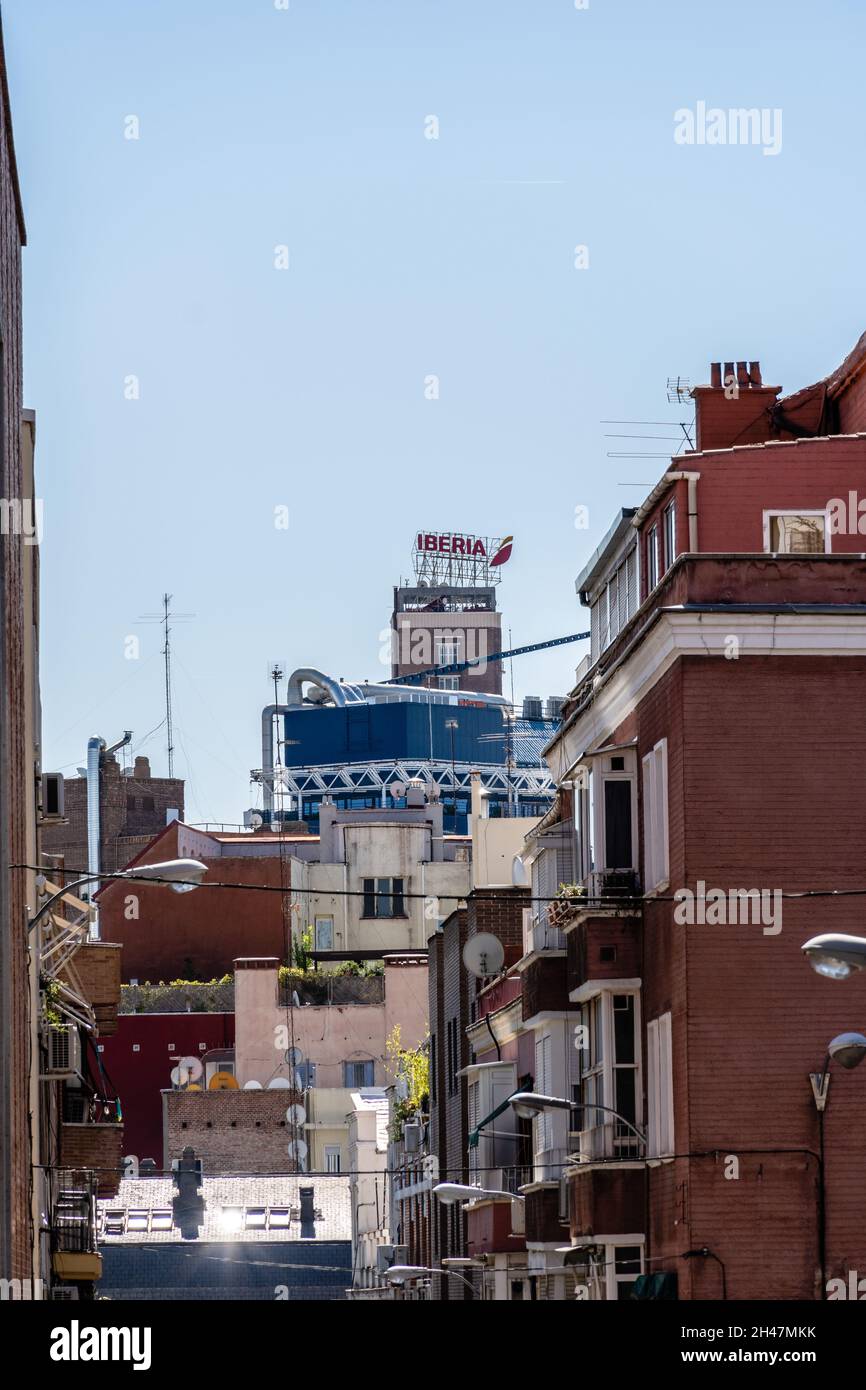 Madrid, Spain - September 12, 2021: Cityscape of Madrid with Iberia Spanish Airline signage on top of building Stock Photo