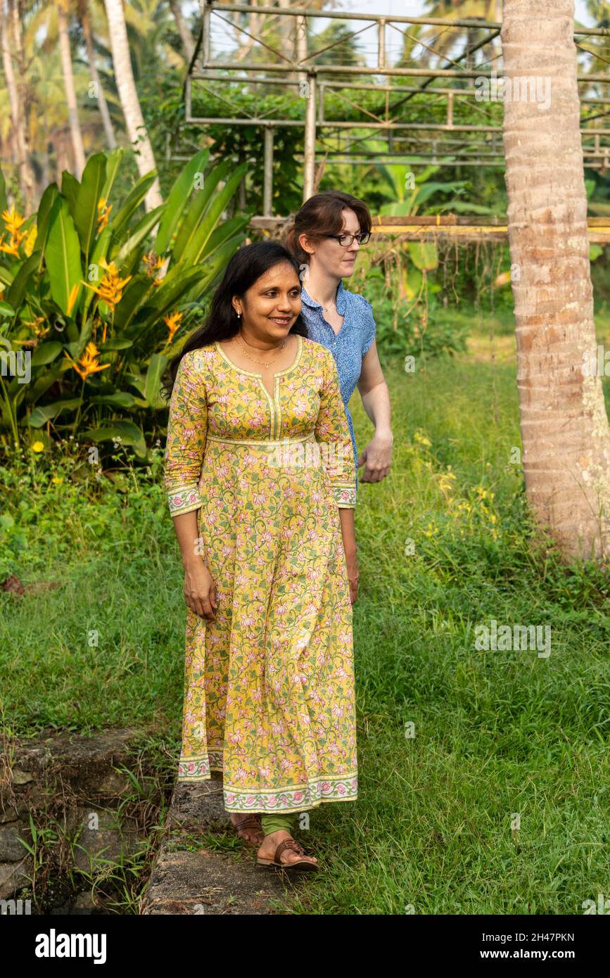 Anu Mathew, one of the family who owns, and runs Philipkutty's farm luxury resort in the backwaters of Kottayam of  Kerala, India.   Anu guiding her Stock Photo