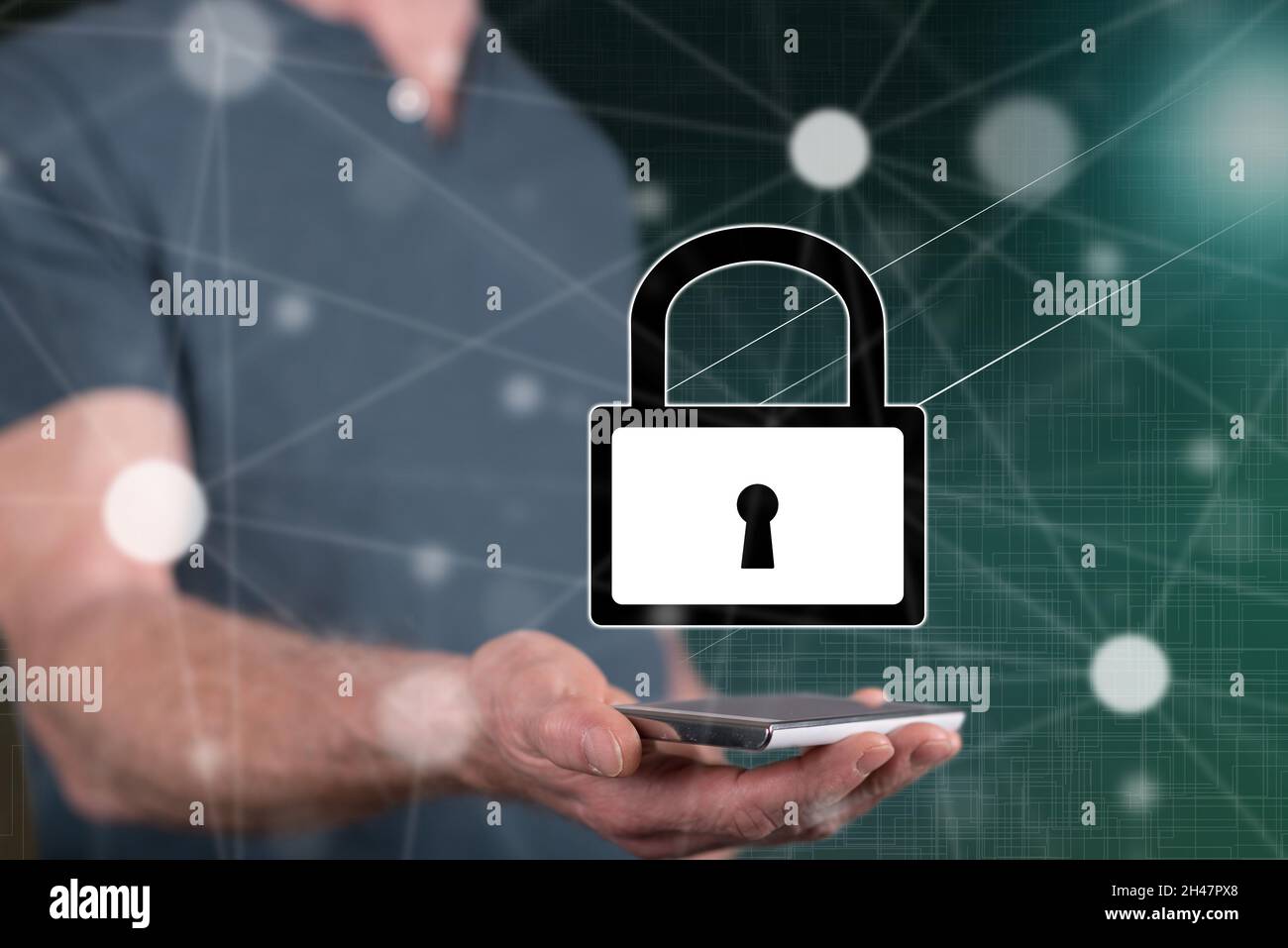 Cyber security concept above a smartphone held by a man in background ...