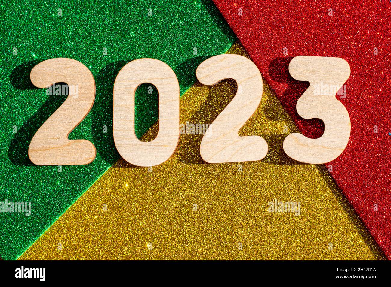 New Years Concept Wooden Numbers 2023 On Multicolored Trending Red Green Gold Glittering Starry Background New Year Card Stock Photo Alamy