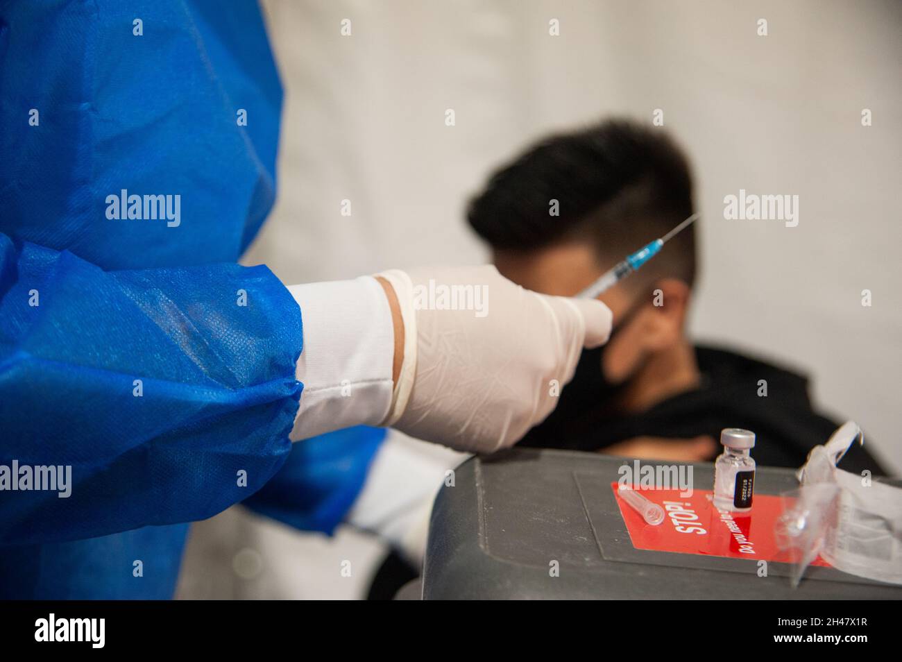 A nurse gets a dose out of the Pfizer BioNTech Vaccine vial as the Colombian government begins to vaccinate children between ages 3 to 11 against the Stock Photo