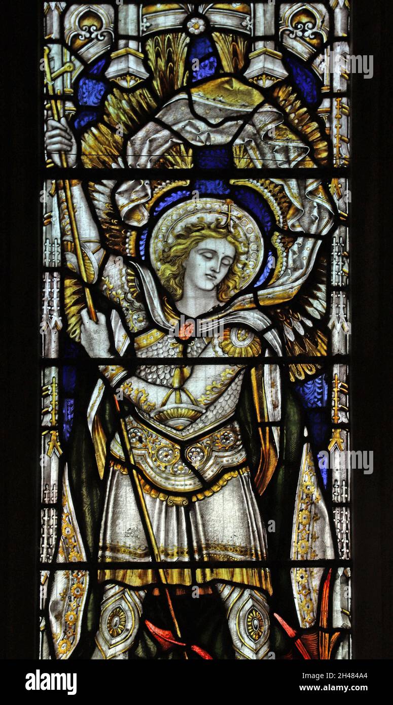 A stained glass window by Herbert Davis depicting Archangel Michael slaying the dragon, St Michael & All Angels Church, Fringford, Oxfordshire Stock Photo