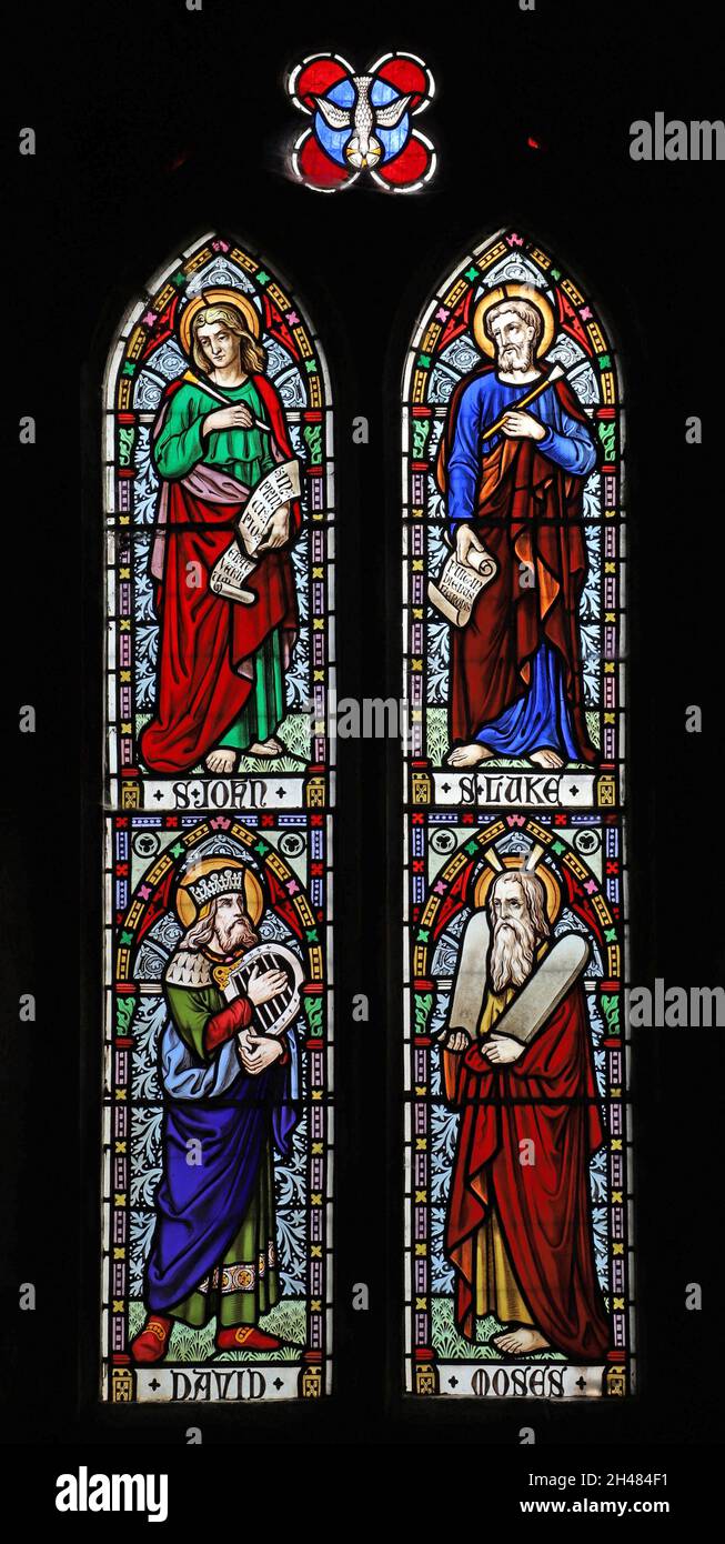 A stained glass window by Michale O'Connor depicting Saints Joan & Luke, and King David & Moses, St Michael & All Angels Church, Fringford, Oxfordshir Stock Photo