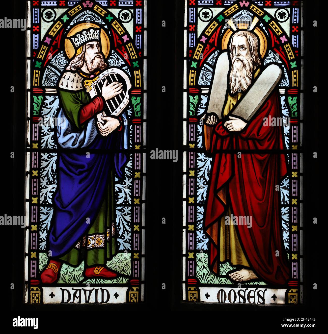 A stained glass window by Michael O'Connor depicting King David and Moses, St Michael & All Angels Church, Fringford, Oxfordshire Stock Photo